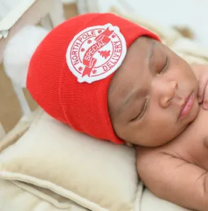 Red or White North Pole Special Delivery with White Fuzzy Pom Pom - Gender Neutral Christmas Hat for Newborns